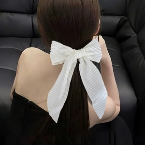 Elegant white pleated bow hair clip with textured fabric for women's hairstyle
