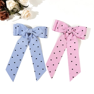 Sweet pink and blue bow hair clips with heart patterns and long ribbon streamers