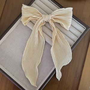 Elegant champagne pleated silk bow hair clip with long flowing ribbons for women