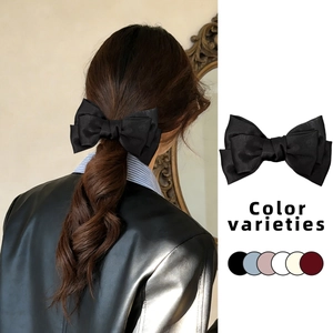 Elegant satin bow hair clip for women featuring double-layered design in multiple colors