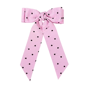 Sweet pink striped bow hair clip with black heart patterns and long ribbon tails