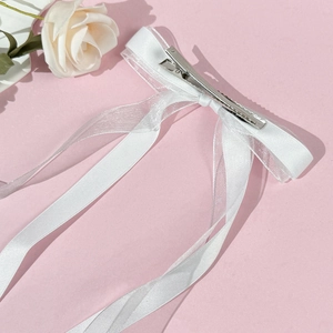 Elegant white ballet-style tulle bow hair clip with long ribbon streamers for women