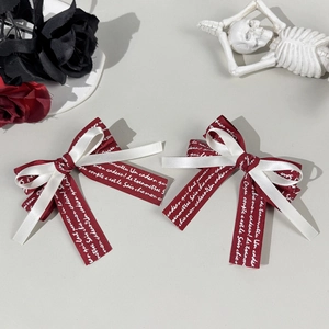 Gothic style red and white layered bow hair clip with French cursive ribbon and rose