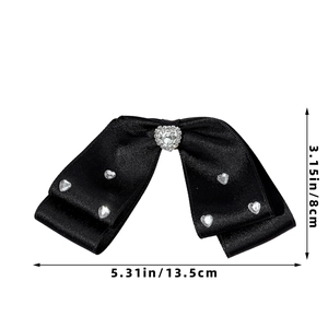Detail showing the dimensions of the black satin bow hair clip with heart rhinestones