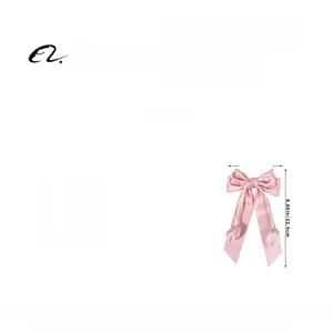 Détails de la pince à cheveux ruban rose avec dimensions 13cm x 22,5cm et poids 20,1g