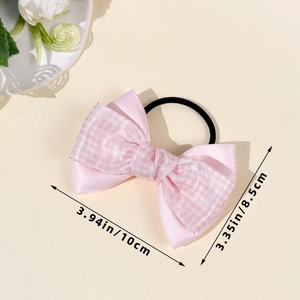 Pink satin bow hair tie detail showing dimensions of 10cm by 8.5cm on a minimal background