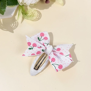 Cute white bow hair clip with pink cherry and polka dot patterns for girls