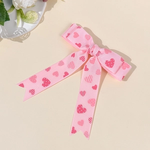 Haarklammer aus rosa Ripsband mit roten Herzmustern und süßem Schleifen-Design