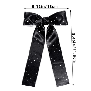 Detailed size view of black polka dot bow hair clip measuring 13cm wide by 21.5cm long