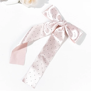 Elegant light pink polka dot bow hair clip with long silk ribbons for women