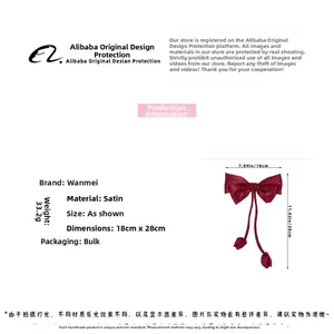 Detailed view of large red satin bow hair clip with specifications and 28cm streamer
