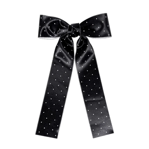 Elegant black satin polka dot bow hair clip with long ribbons on a white background