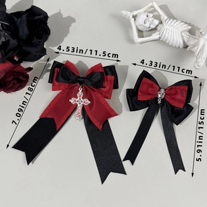 Gothic red and black satin bow hair clips with silver cross and skull charm details