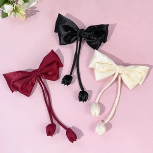 Elegant satin bow hair clip set with tulip charms in black, burgundy and cream colors