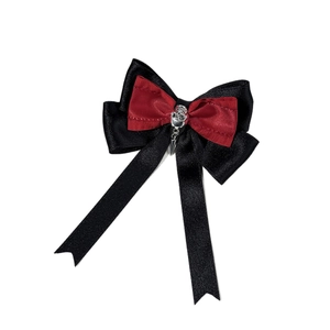 Gothic red and black satin bow hair clip with silver skull and metal cone pendants