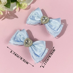 Detailed size view of blue lace heart bow hair clips with rhinestones and pearls