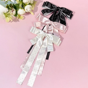 Barrettes à nœuds en satin à pois avec longs rubans en noir, rose et blanc élégant