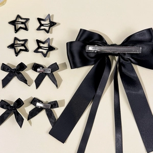 9-teiliges Haarschmuck-Set mit schwarzen Schleifen und Stern-Clips aus Seidenband