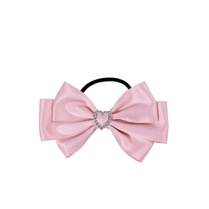 Pink satin bow hair scrunchie with rhinestone heart detail and black elastic band