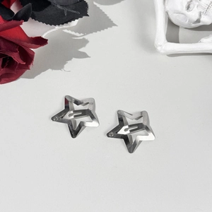 Detail of silver hollow star hair clips with metal BB clip closure for women
