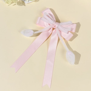 Detailansicht der rosa Schleife Haarspange mit Tulpen-Quasten und Organza-Band