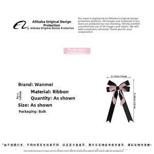 Dettaglio delle dimensioni del fermaglio a fiocco rosa e nero, misura 13 cm per 23 cm