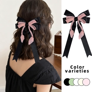 Elegante molletta per capelli con fiocchi di raso disponibile in cinque colori pastello