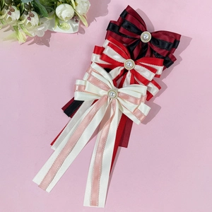 Elegant layered bow hair clips with lace trim and pearls in black, red, and pink colors