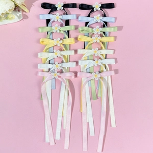 Floral embroidered bow hair clips with long satin ribbons in various pastel colors