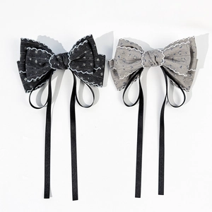 Elegant floral bow hair clips with white lace trim and long black ribbons, 2-piece set