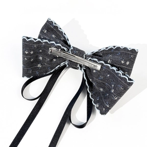 French chic floral bow hair clip with denim fabric, white stitching and long black ribbons
