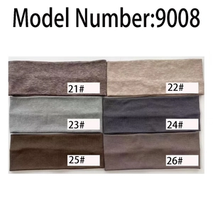 Flat lay of six elastic ribbed cotton yoga headbands in various neutral earth tones
