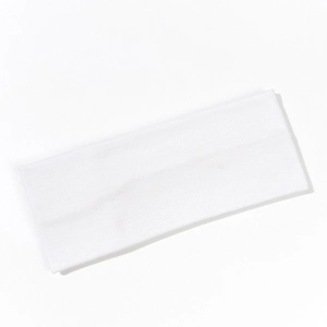 Macro detail of white ribbed knitted cotton yoga headband with fine elastic texture
