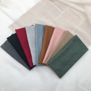 Set of 9 colorful ribbed knitted headbands for women in various trendy solid colors