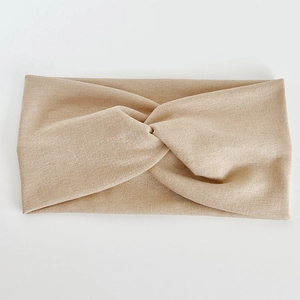 Bandeau croisé beige élastique avec tricot côtelé élégant pour un port quotidien confortable