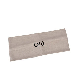 Minimalist beige knitted yoga headband with black Olá print for sports or daily wear