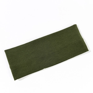 Detail shot of olive green ribbed knit headband texture and high-quality cotton fabric