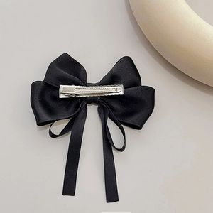 Elegant black satin bow hair clip with long ribbons and a silver alligator clasp detail