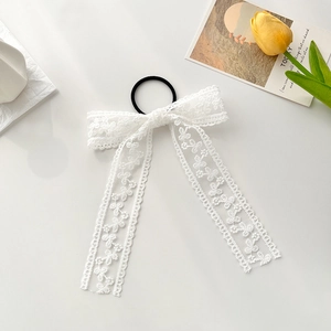 Elegant white lace bow hair tie with floral embroidery and long ribbons for women