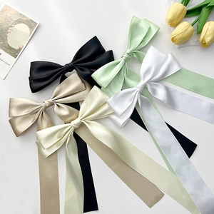 Elegant satin bow hair clips with long ribbons in multiple solid colors for women