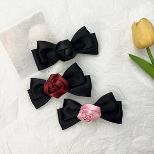 Elegant set of satin rose bow hair clips in black, wine red, and pink colors