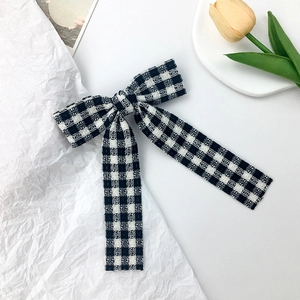 Japanese style black and white plaid bow hair clip with long ribbons and elegant weave pattern