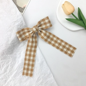 Plaid bow hair clip for women with vintage brown and white checkered fabric design