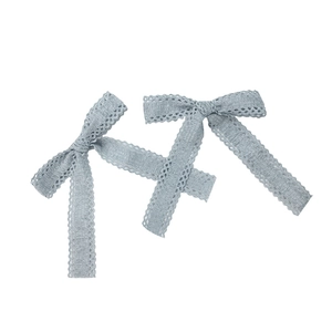 Set of two light blue lace bow hair clips with long ribbon streamers in minimalist style