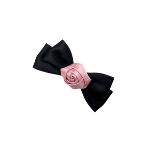 Elegant black satin ribbon hair clip with a pink silk rose for a French retro style look