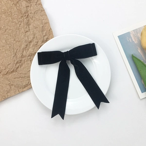 Elegant black velvet bow hair clip with long swallowtail streamers for women