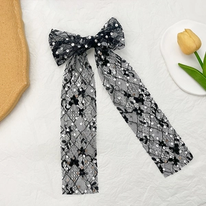 Elegant black lace bow hair clip with silver fish scale sequins and long flowing ribbons