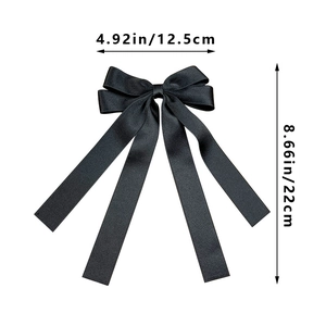 Detail view of the black satin bow hair clip with long ribbons and size dimensions