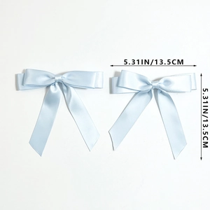 Close-up of dual-layer light blue satin bow hair clips with long silky ribbons and dimensions