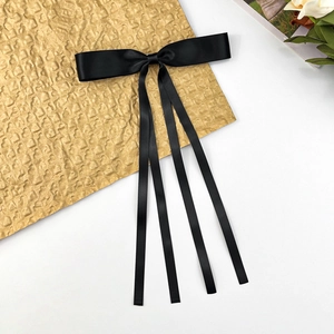 Elegant solid black satin long ribbon bow hair clip with flowing streamers for women
